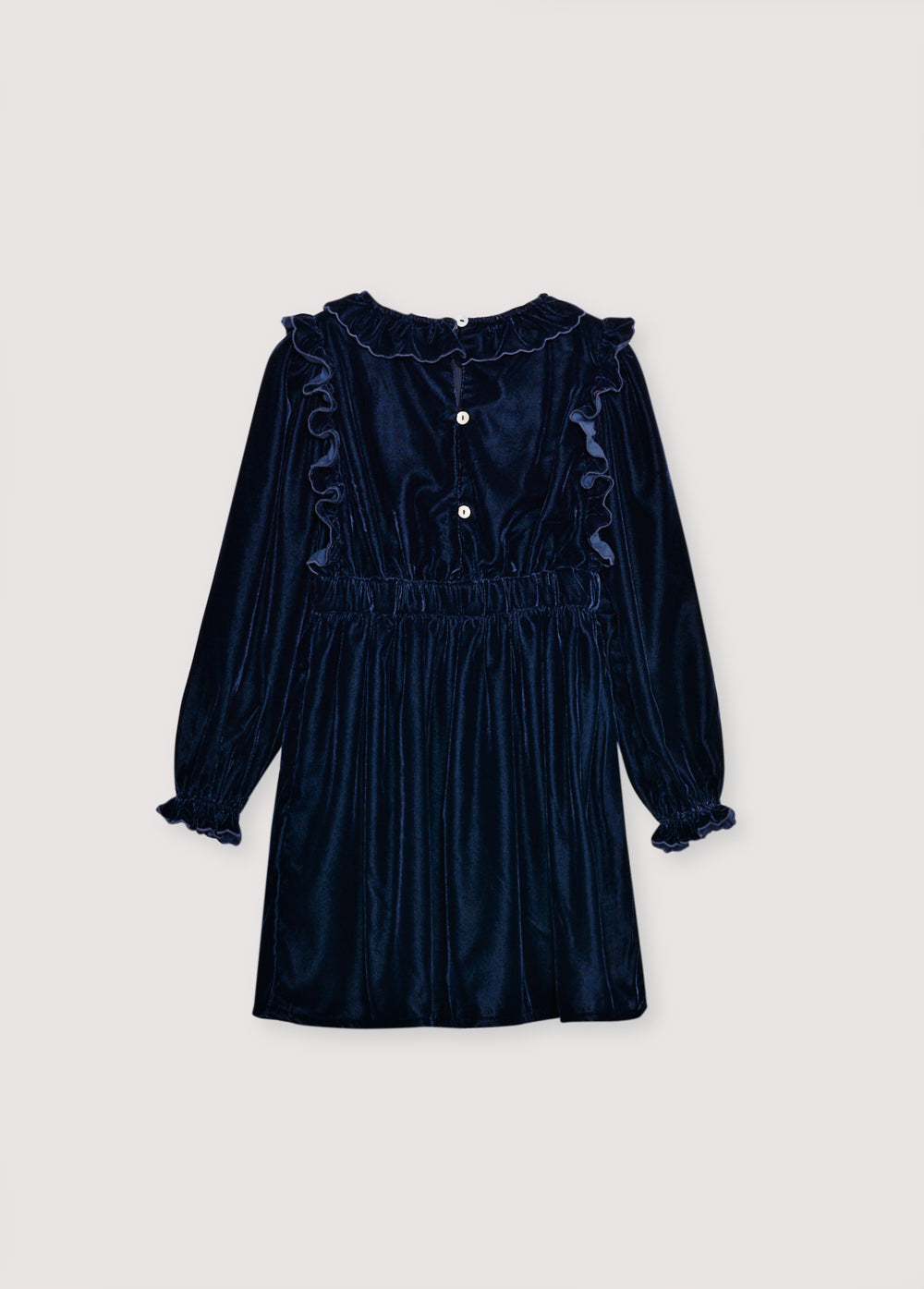 Velour dress with a fitted waist, featuring embroidery detail on the chest and two embroidered pockets on the skirt. It is finished with ruffles at the cuffs and opens at the back with ruffled details. The dress has cotton lining in tone.