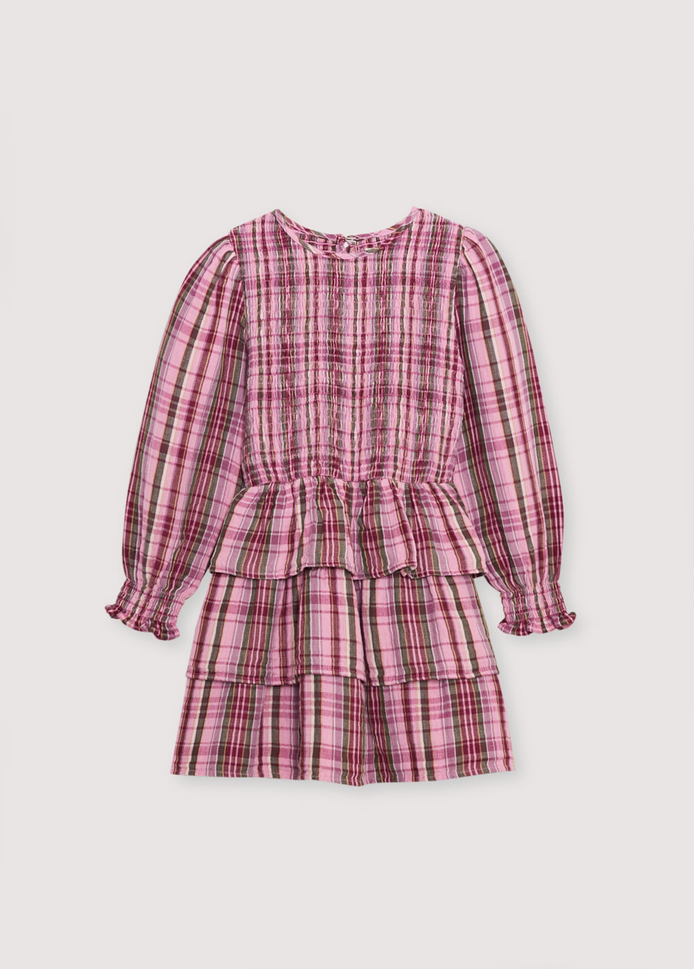 Short checkered double gauze dress with a smocked bodice, elasticated fitted waistband, and three ruffles on the skirt. It features a back opening with a teardrop cut and button closure.