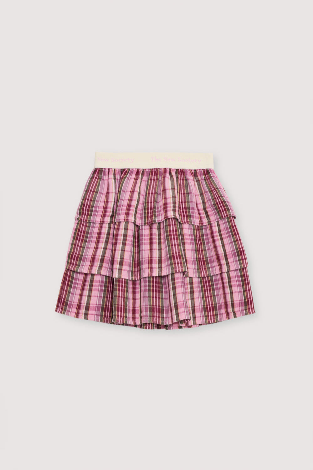 Checkered skirt in double gauze fabric with three ruffles and a branded elastic waistband. Perfect for pairing with the matching blouse.