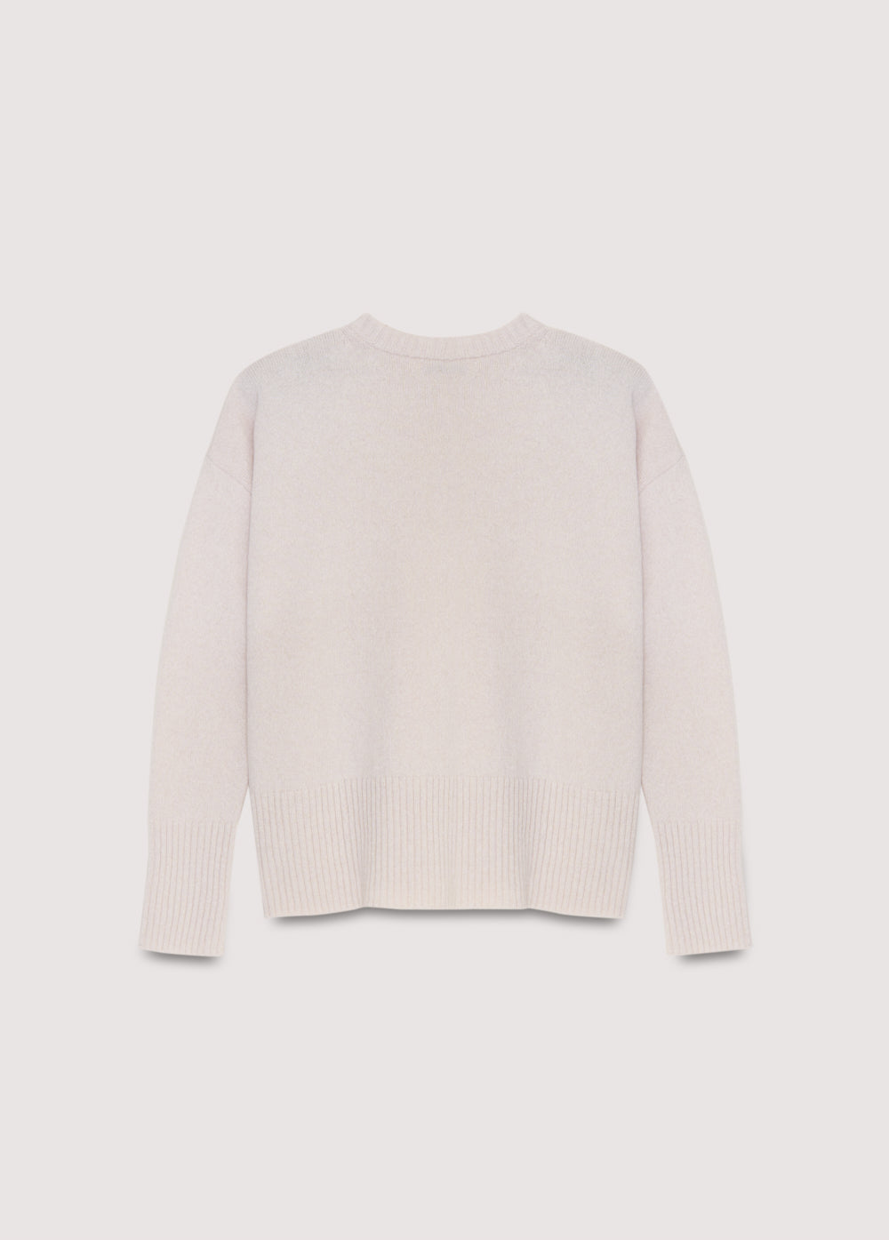 Cashmere sweater with a round neck and wide ribbing at the cuffs and hem. It features side slits.