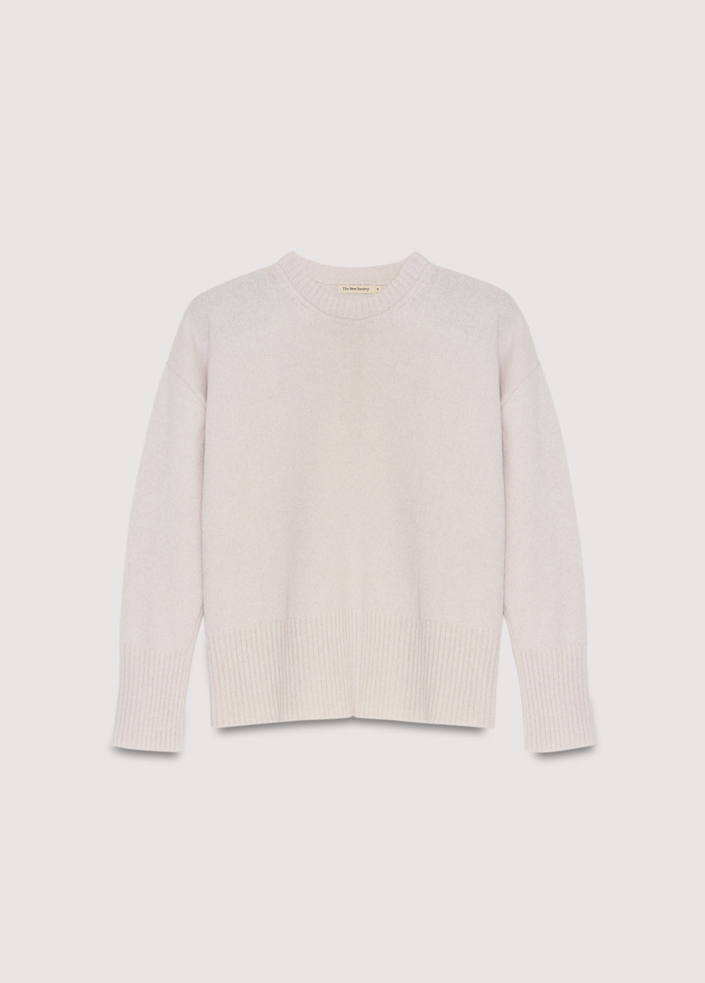 Cashmere sweater with a round neck and wide ribbing at the cuffs and hem. It features side slits.