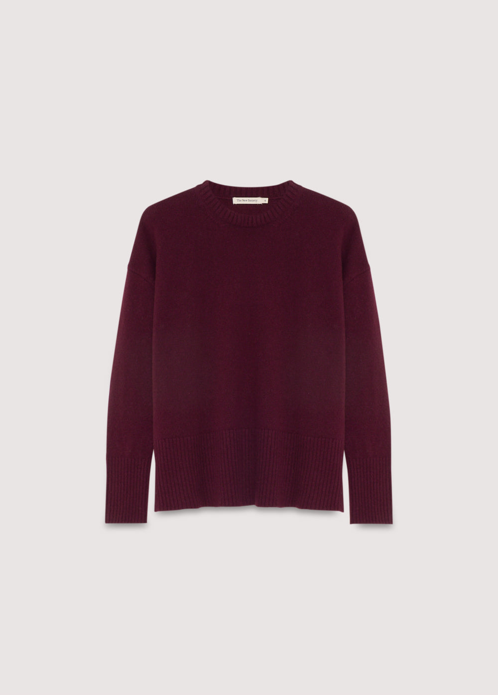 Cashmere sweater with a round neck and wide ribbing at the cuffs and hem. It features side slits.