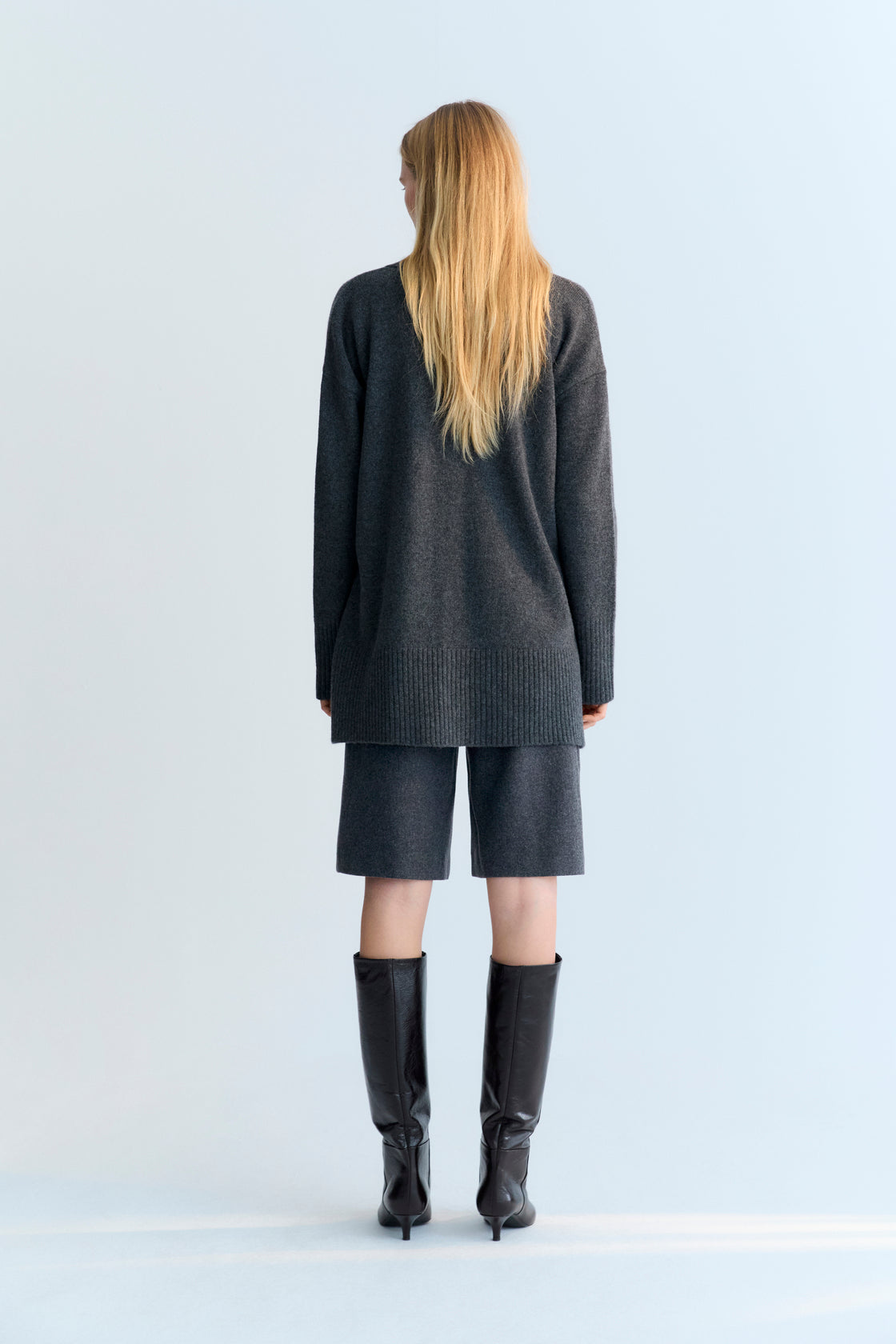 Oversized cashmere knit cardigan with tone-on-tone buttons.