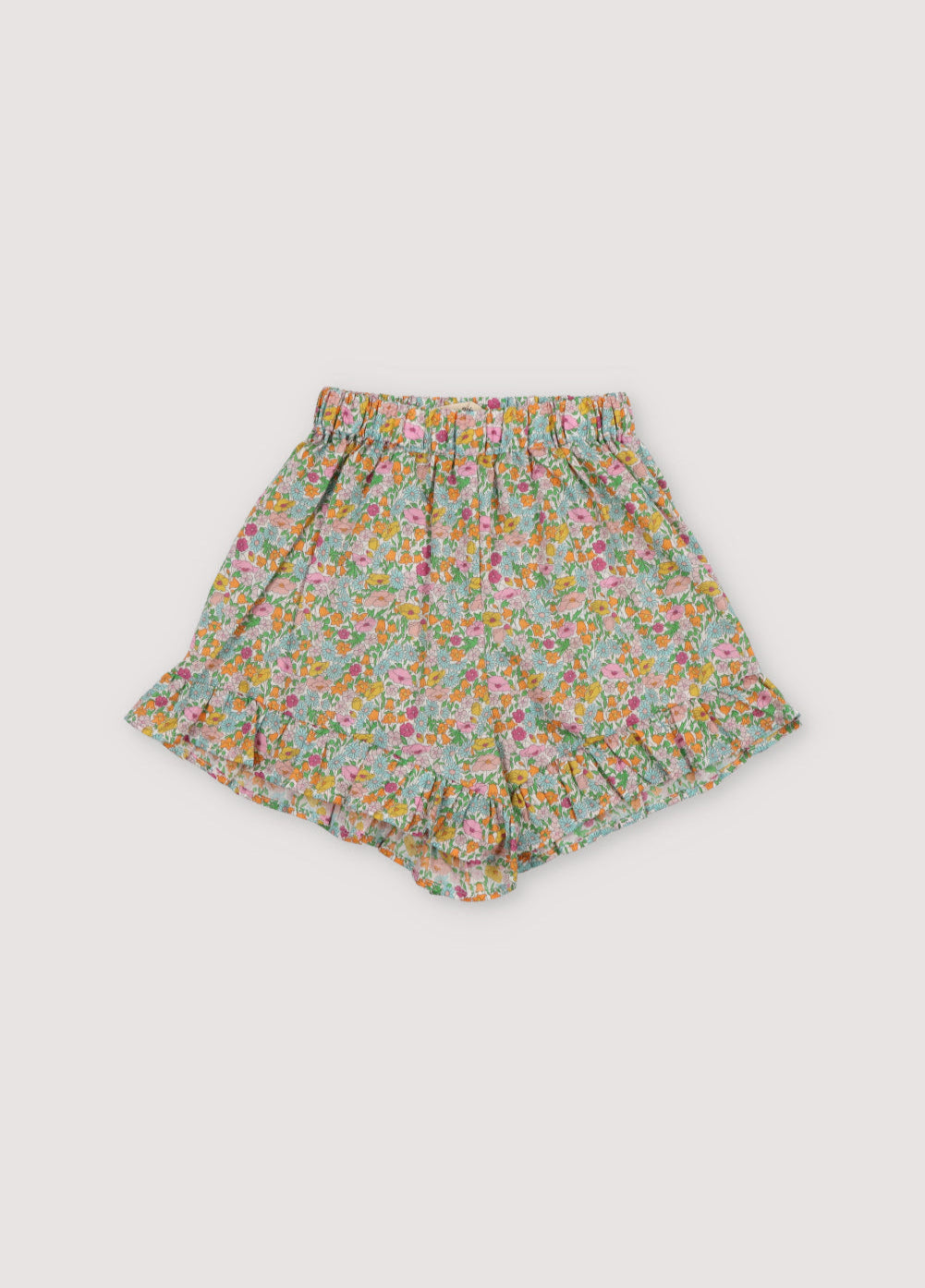 Andreas shorts in Liberty fabric 100%cotton, with an elastic waistband, side pockets, and ruffle details at the waistband and hem.
