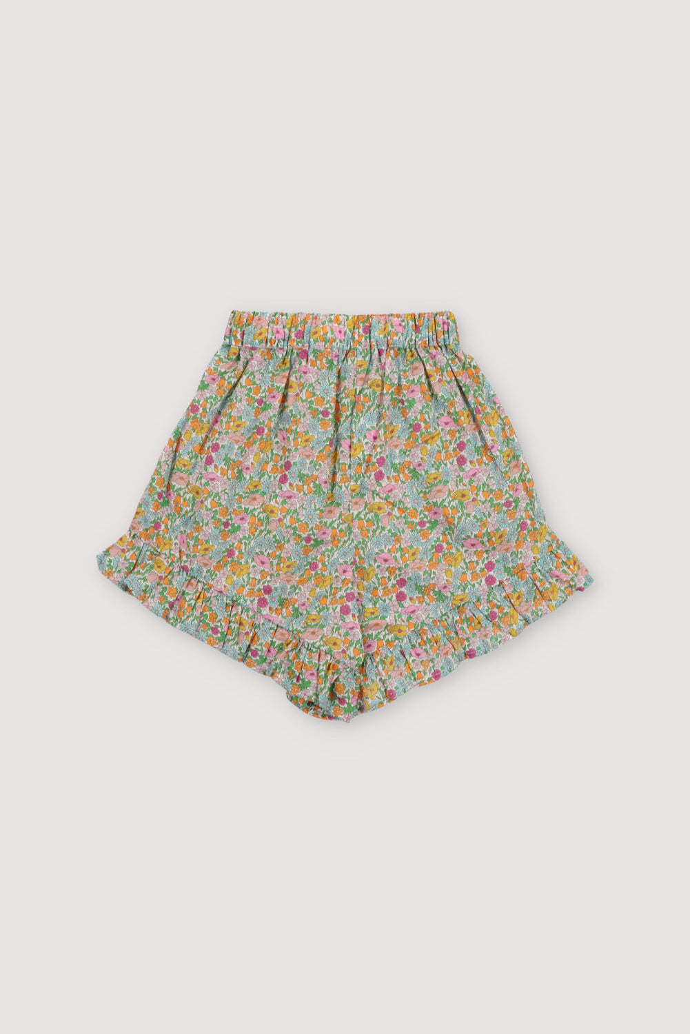 Andreas shorts in Liberty fabric 100%cotton, with an elastic waistband, side pockets, and ruffle details at the waistband and hem.