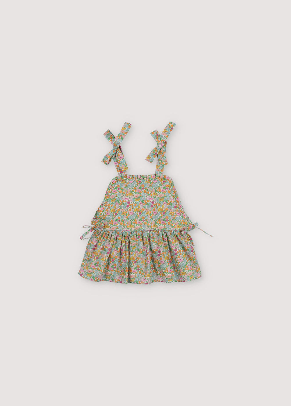 Andreas Top in Liberty fabric 100%cotton, with shoulder bows, front ruffles, and a cut to create volume in the ruffle.