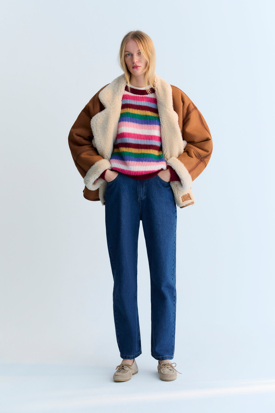 Fine-knit multicolor mohair sweater with a round neckline.