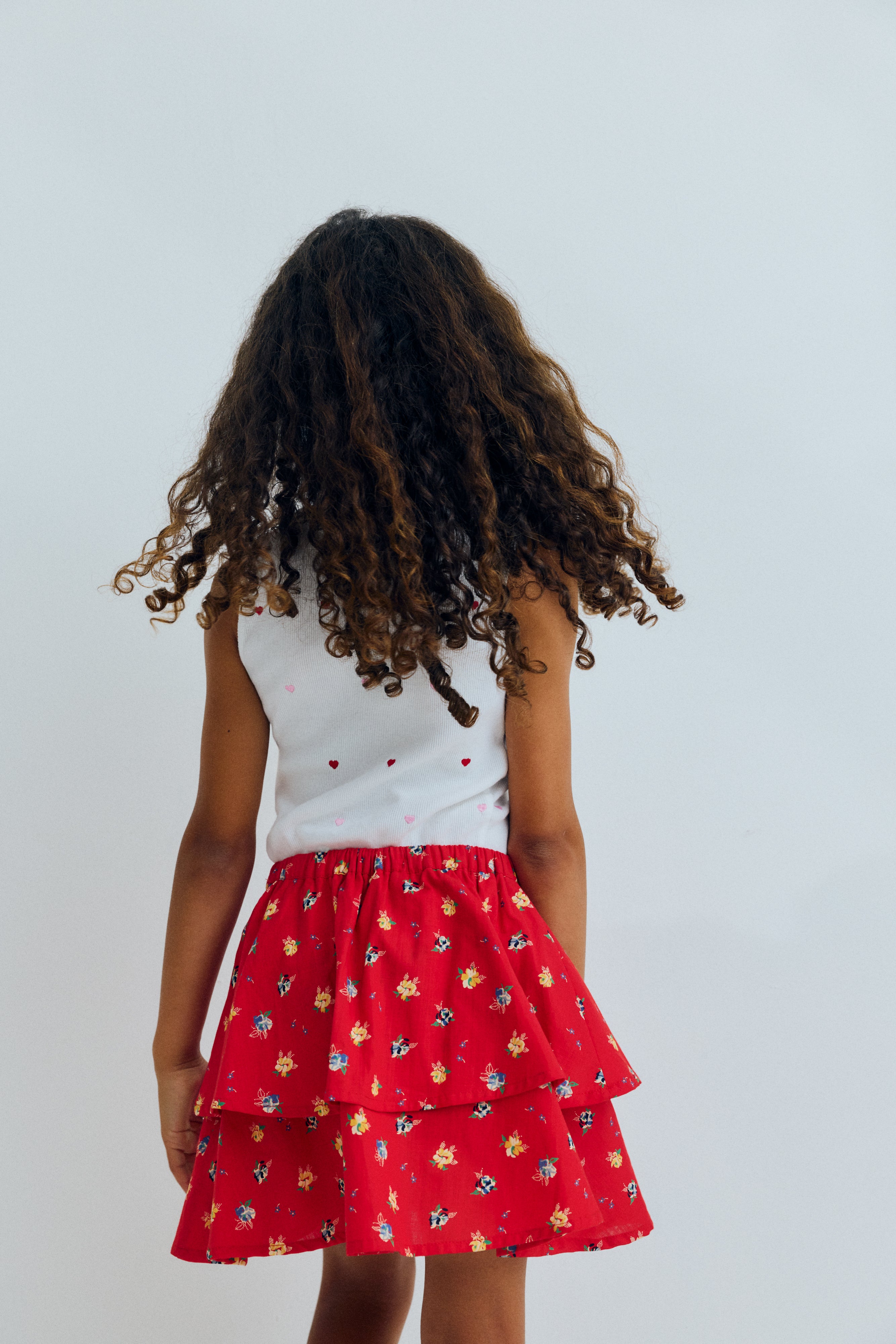 A pretty skirt crafted from 100% organic cotton with a vibrant multicolor floral print.