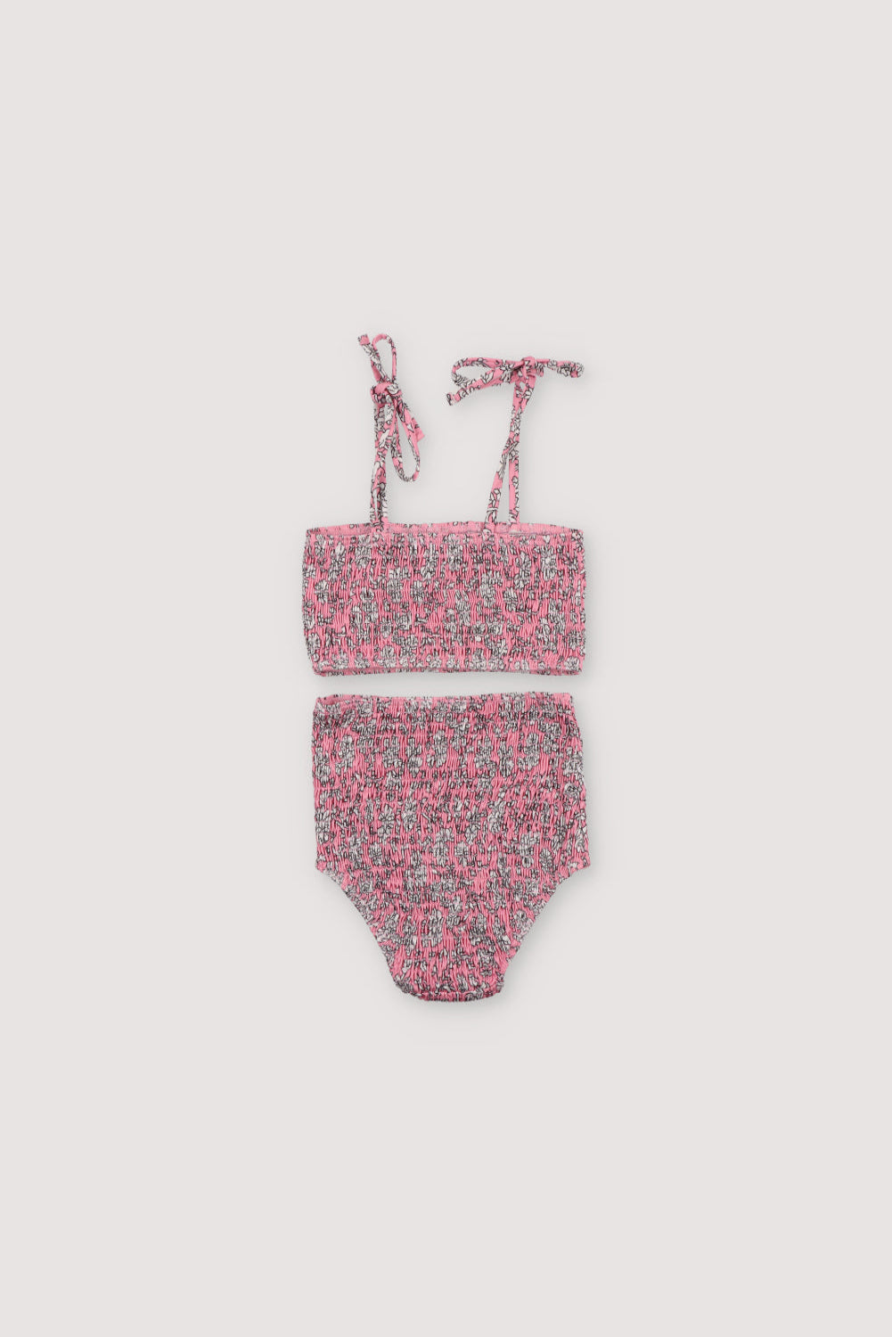 Bikini with floral print and smocking on both pieces, featuring straps to tie on the shoulders.
