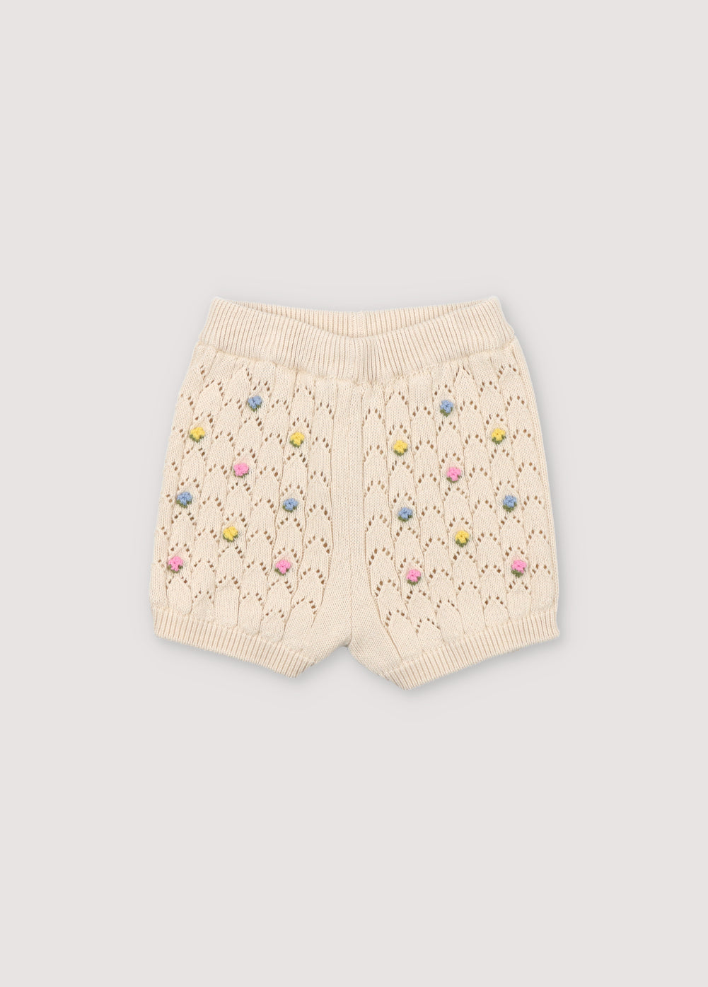 Short with structure and flower details. It has ribbed waistband and cuffs. Perfect to combine with the matching cardigan and top.