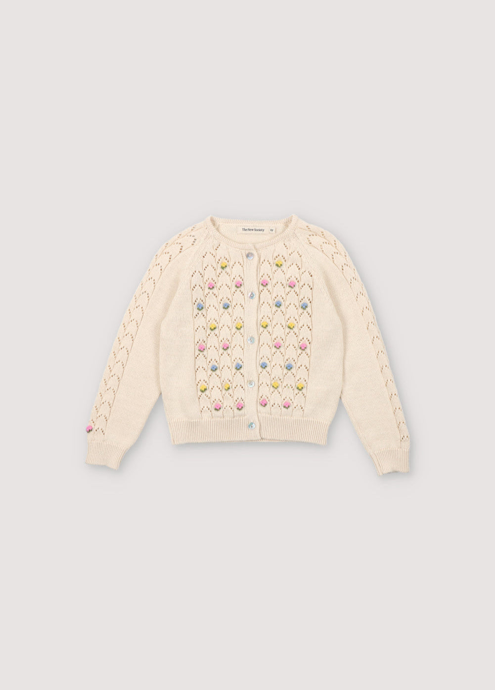 Cardigan with structure and flower details. It has a wooden button opening. Perfect to combine with the marching short and top.