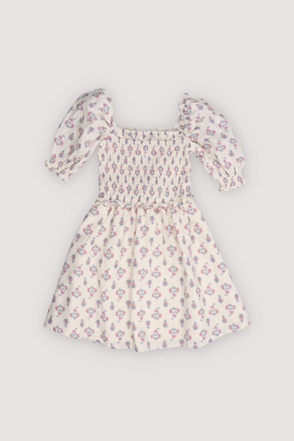 Dress in soft 100% cotton with a charming seal print, smocked bodice, and double-layered ruffle skirt.