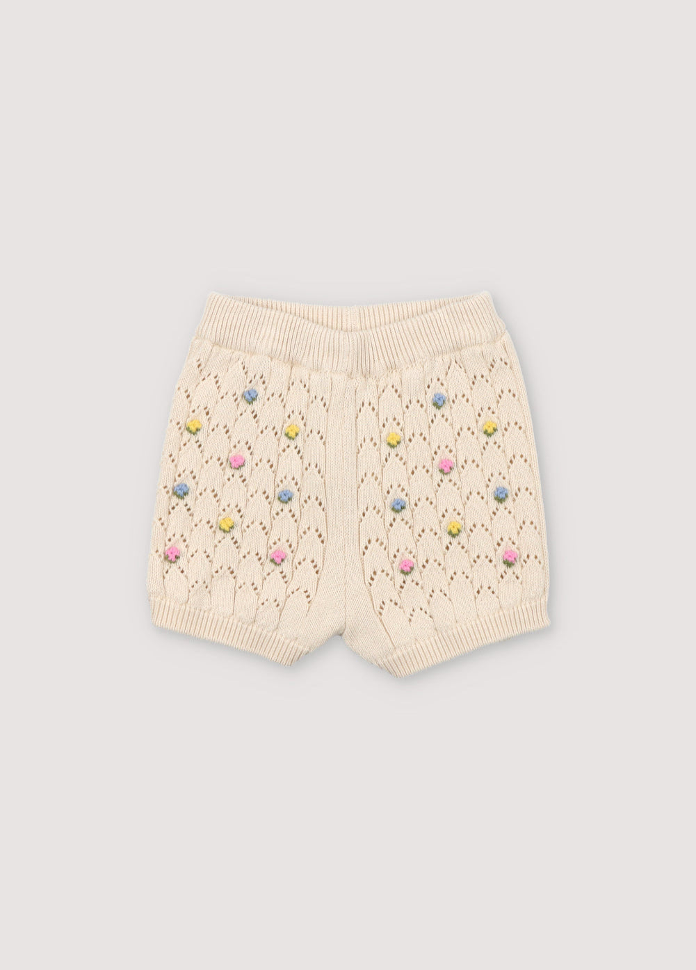 Short with structure and flower details. It has ribbed waistband and cuffs. Perfect to combine with the matching cardigan and top.