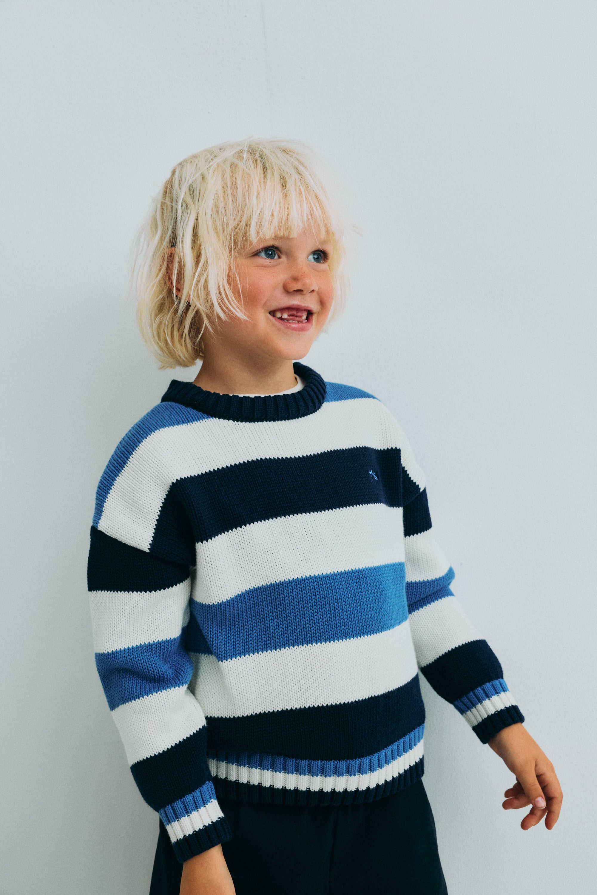 Our classic striped cotton knit featuring ribbed striped details that make this piece special and unique.