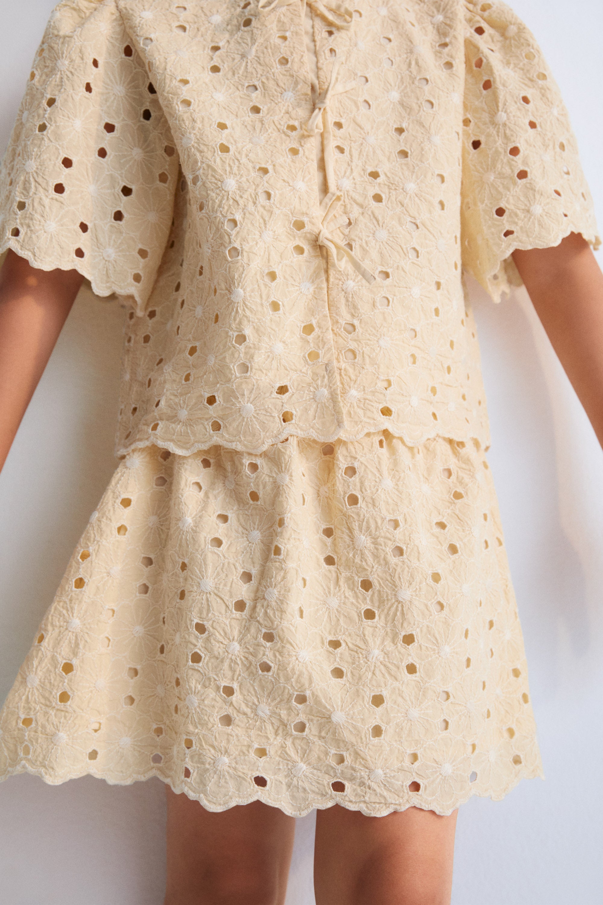 Creta Skirt in embroidered blend cotton fabric in macadamia color, featuring an elastic waistband.