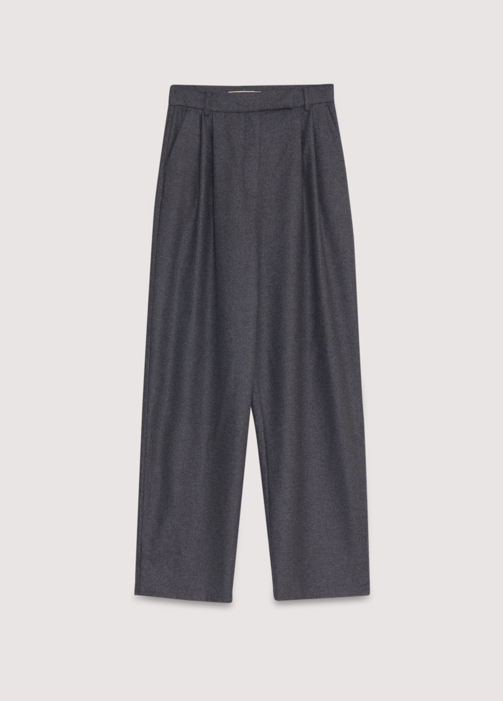 Wool pant with pleat detail in the front and side pockets. They feature a waistband with a hidden button closure.