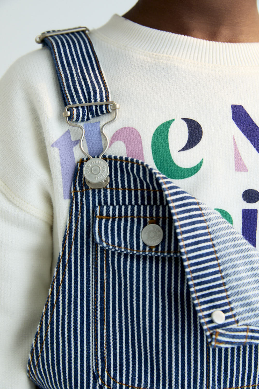 Denim overalls in Infinite Navy with a subtle striped effect and contrast stitching for a standout finish