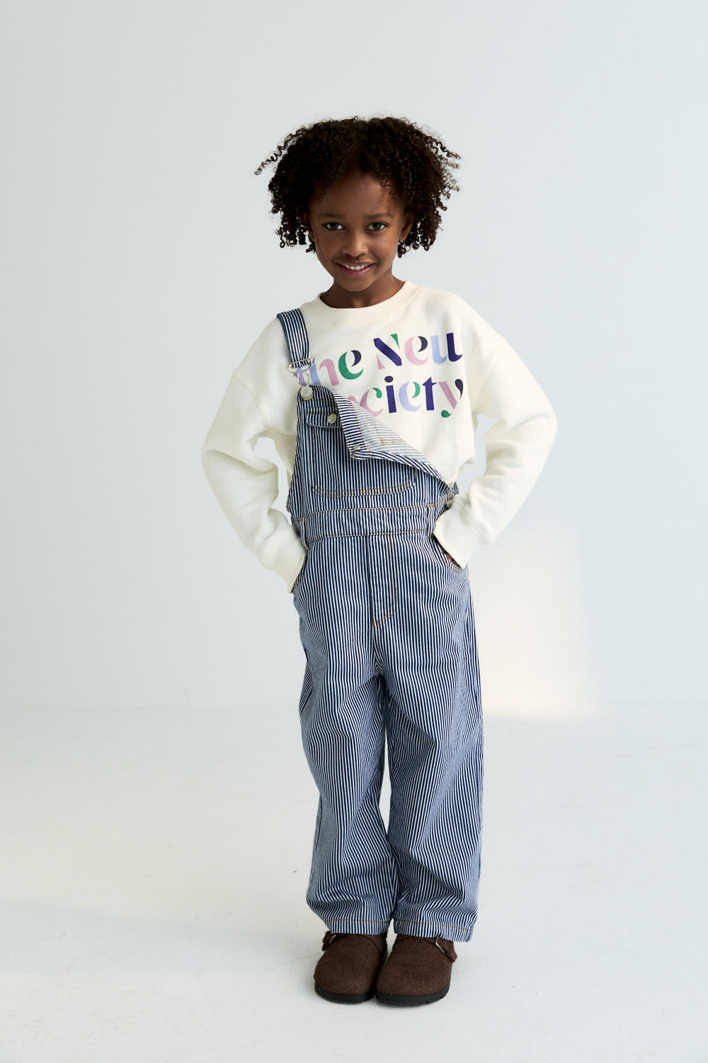 Denim overalls in Infinite Navy with a subtle striped effect and contrast stitching for a standout finish