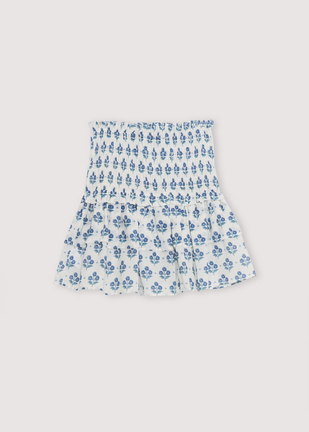 Eleni Teen Skirt in 100% cotton muslin fabric with our hyacinth print. The skirt has a smocked waistband and two flared ruffles.
