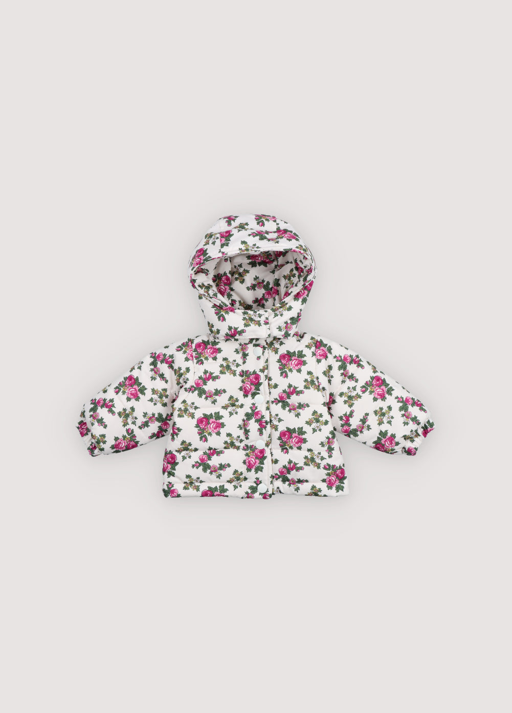 Jacket in outerwear quality with a beautiful colorful print. It features a detachable hood and a front opening with tone-on-tone snaps and zipper.