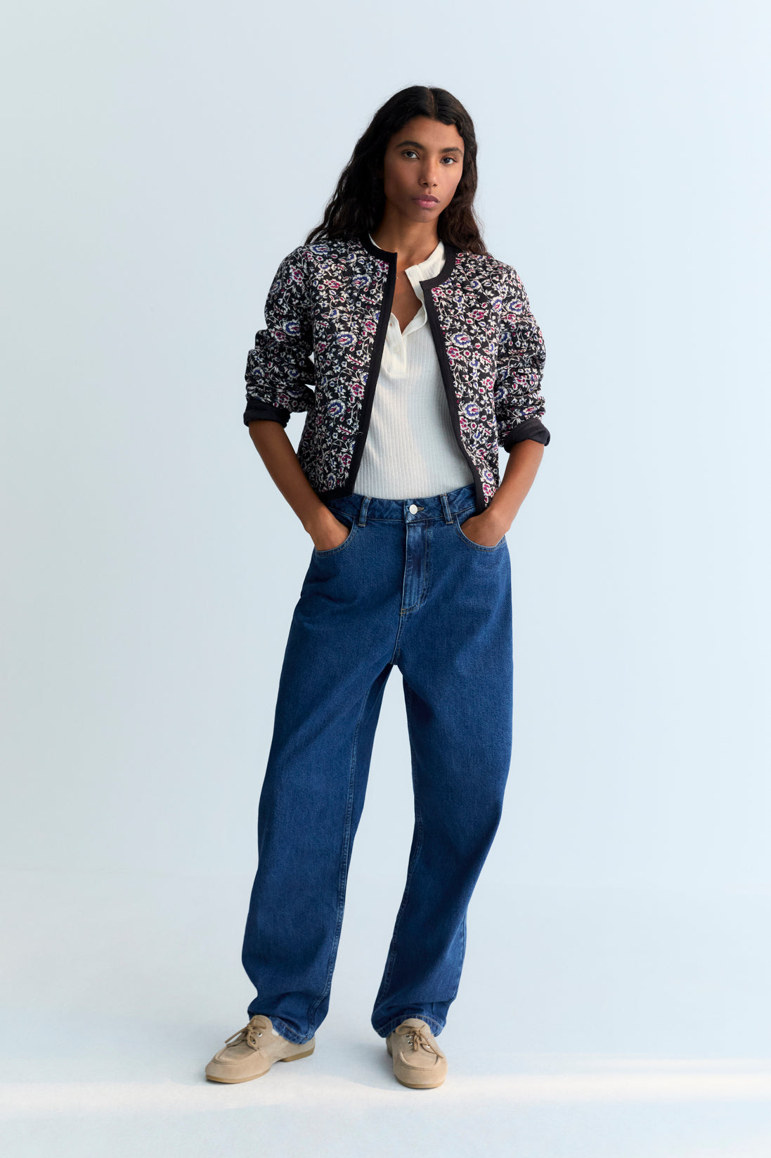 Quilted cropped jacket with a beautiful print design and finishes with a herringbone tape in tone.