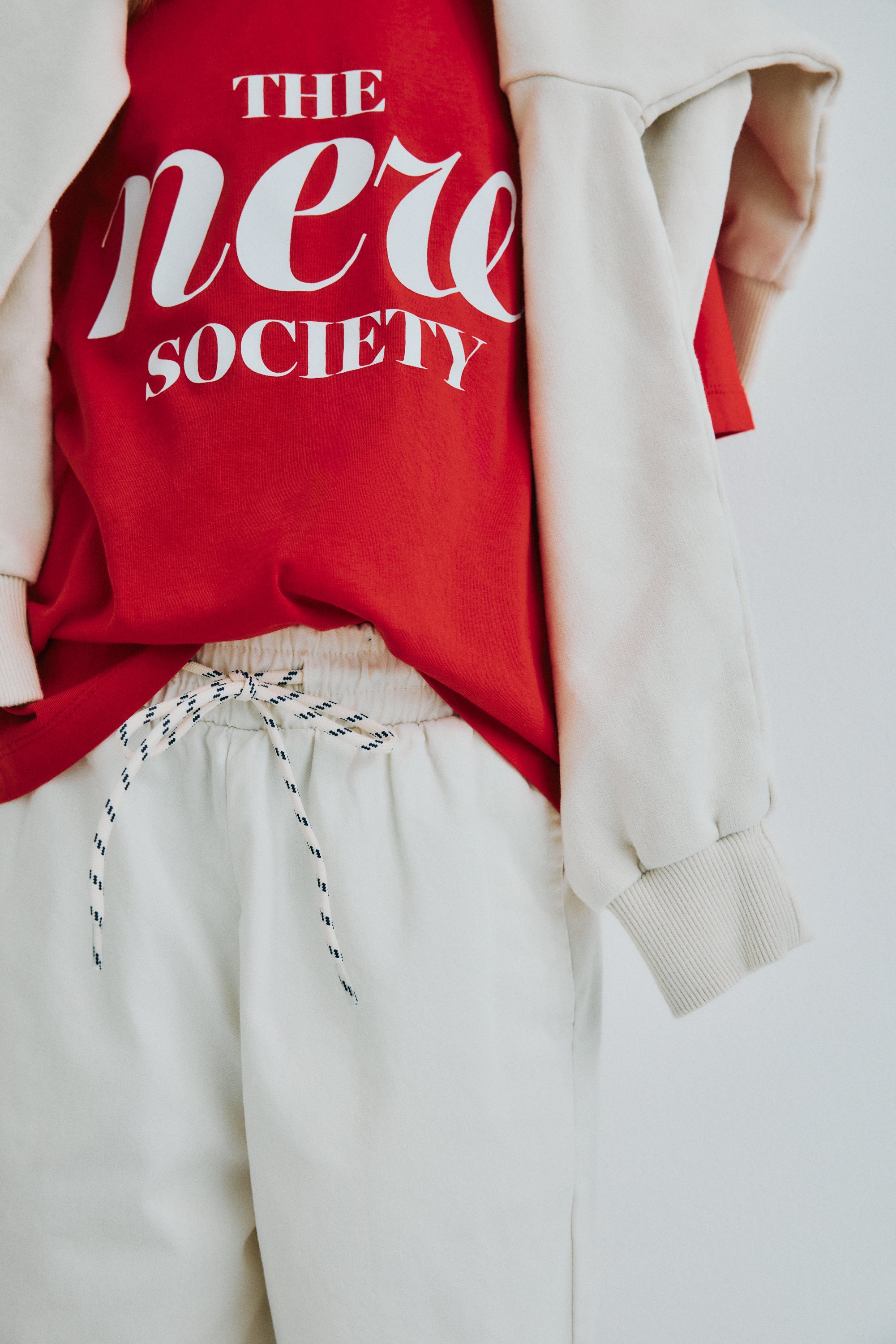 Soft cotton bermuda shorts with side and back pockets, a tone on tone adjustable drawstring waistband with contrast speckles, and matching branded embroidery on the back for a casual, stylish finish.