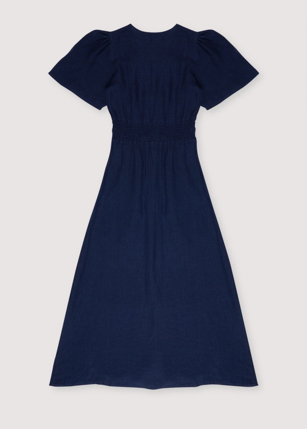 Our bestseller now available in solid colors. Hera Woman Dress 2 in 100% linen, available in three colors: navy, hibiscus, and palm. V-neck, short sleeves with shoulder gathering, and center front buttons.