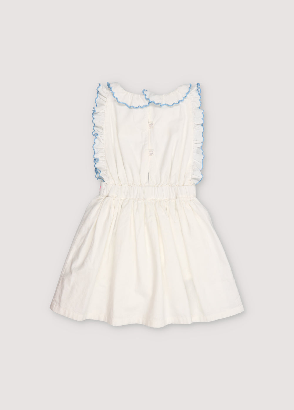 Hermione Dress in 100% white cotton baize fabric with flower embroidery. Dress with gathered neckline, ruffles, and elastic waistband with flower embroidery, and final embroidery detail in powder blue