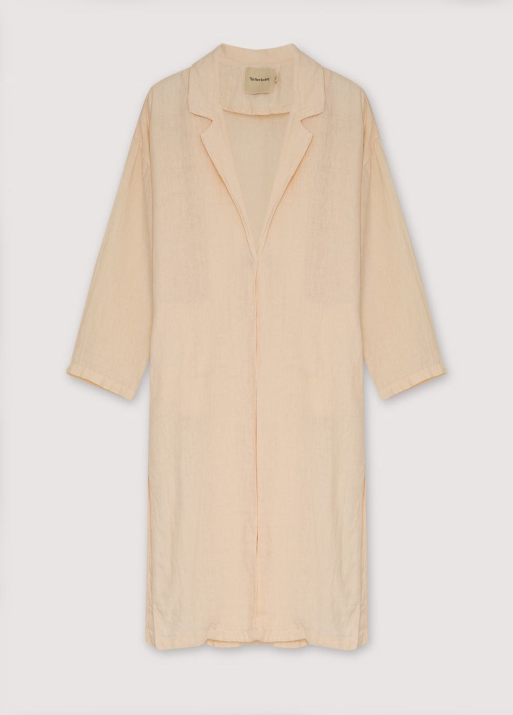 Hera Woman Coat in 100% linen available in three colors: caviar, macadamia, and olive, to complement our total look blouse and pant ensemble. Features lapel collars, inner button closure, and side pockets inserted into the seam. Spring Summer. The New Society.