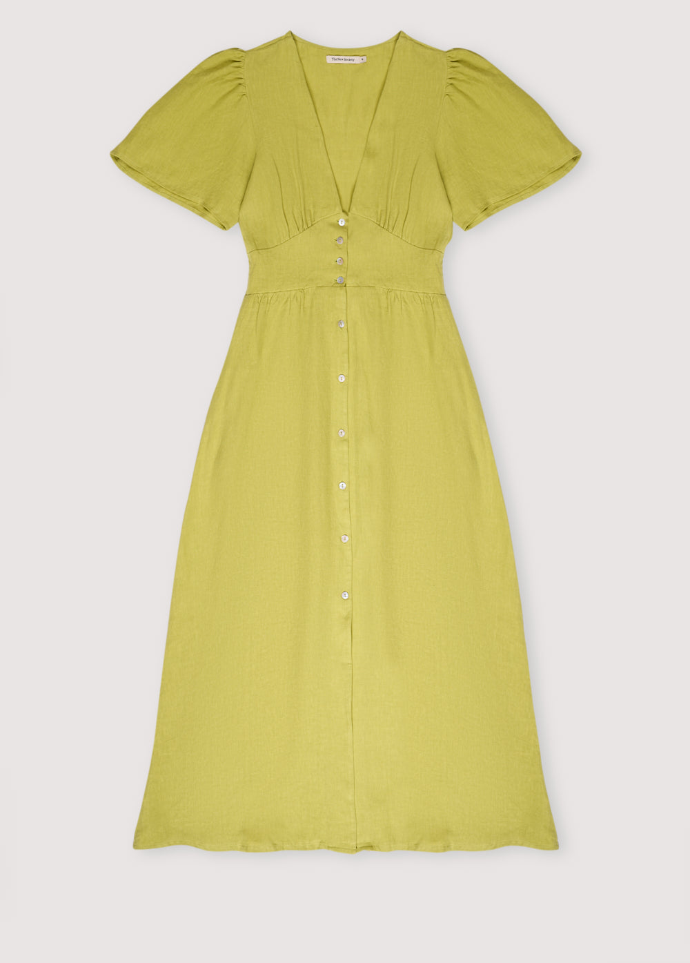 Our bestseller now available in solid colors. Hera Woman Dress 2 in 100% linen, available in three colors: navy, hibiscus, and palm. V-neck, short sleeves with shoulder gathering, and center front buttons.