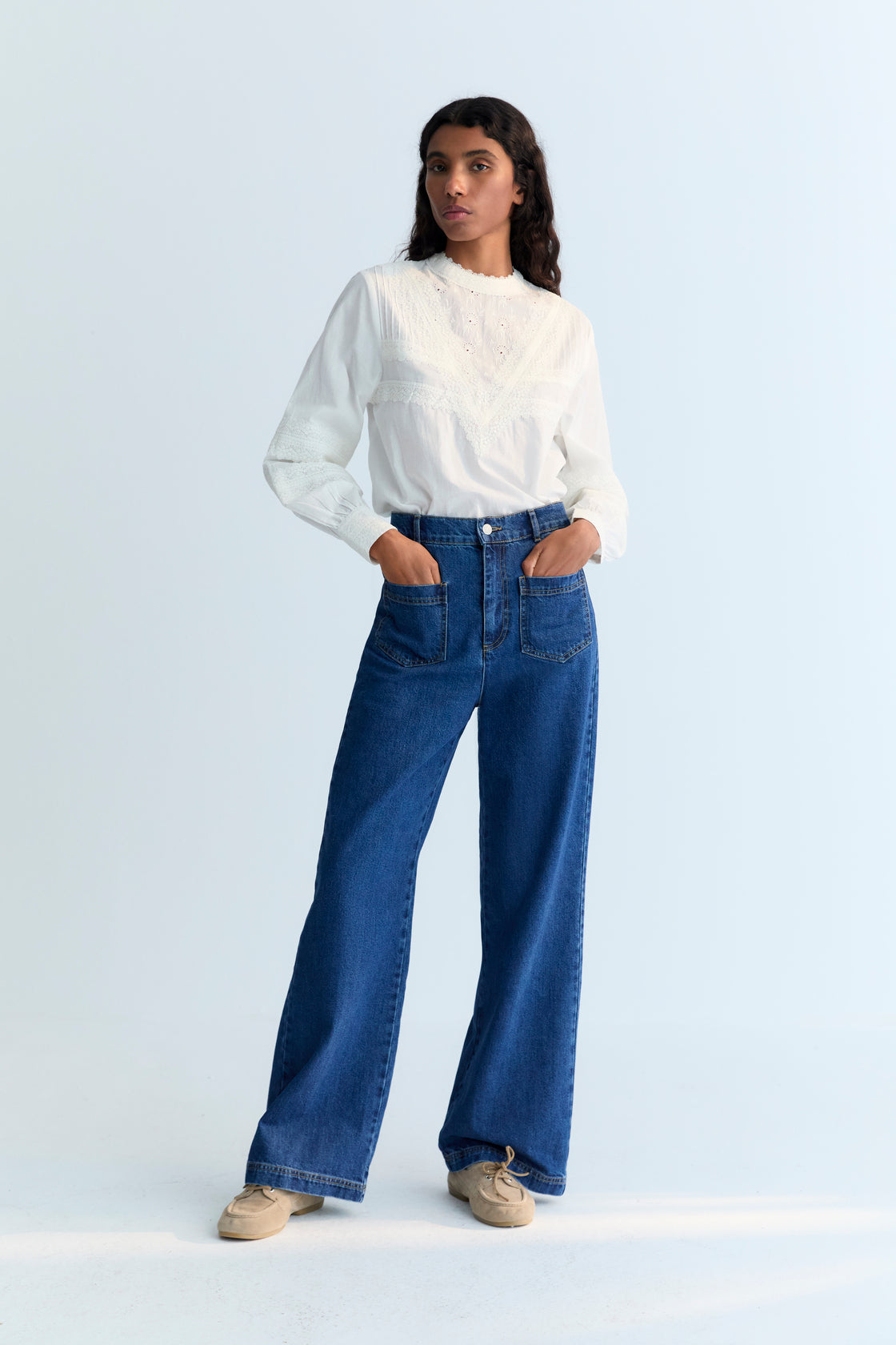 70s-inspired denim pants with front patch pockets and back dart detail with pocket.
