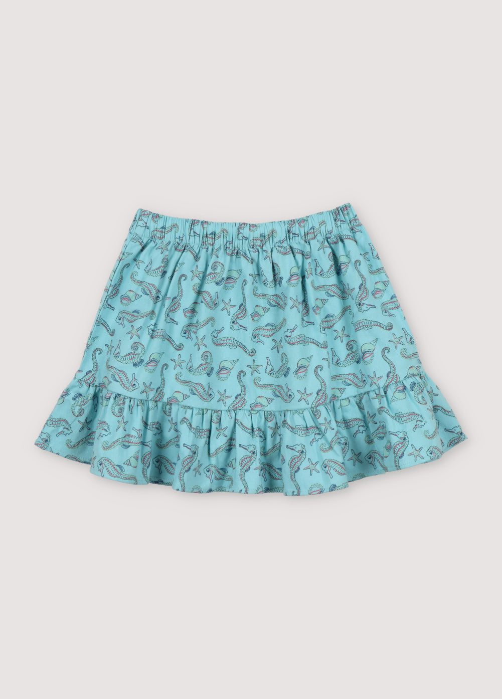 Io Skirt in 100% cotton fabric with our seahorses print, featuring an elastic waistband and a cut to generate more volume in the ruffle.