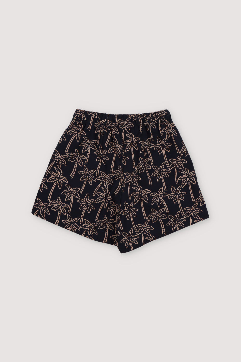 Ithaki Bermuda in 100% cotton with our Palms Navy print, elastic waistband, and adjustable drawstring.