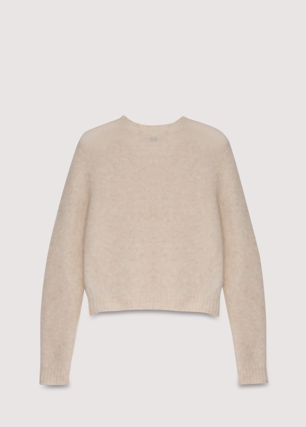 Alpaca and merino wool knit cardigan with a mother-of-pearl button closure.