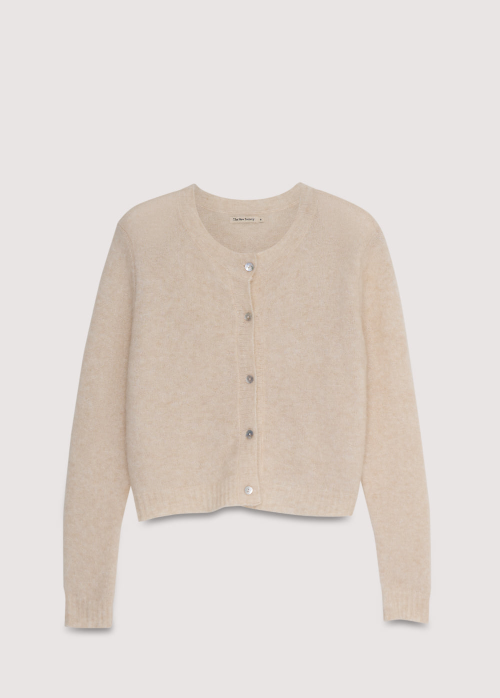 Alpaca and merino wool knit cardigan with a mother-of-pearl button closure.