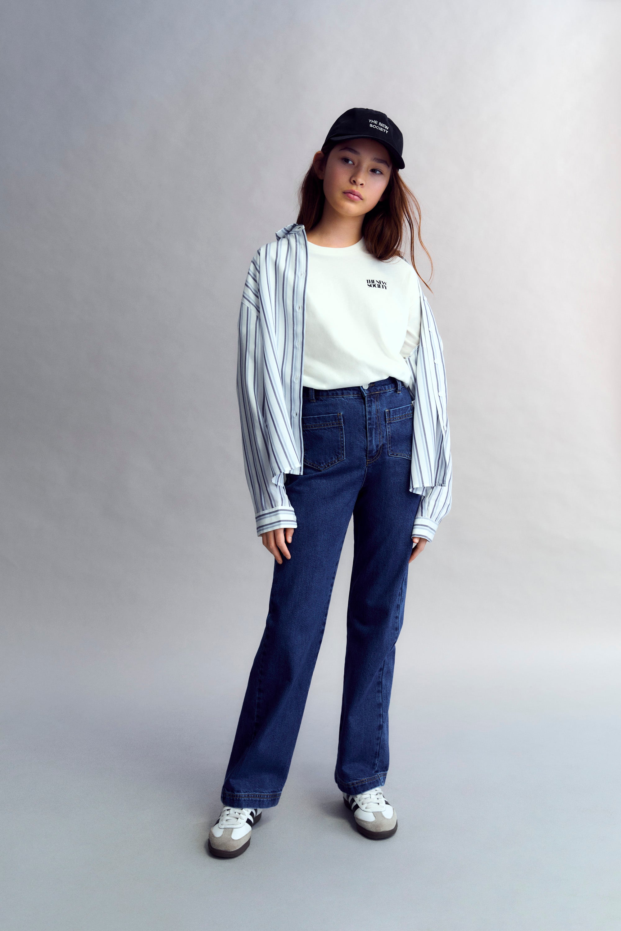 70s-inspired denim pants with front patch pockets and back dart detail with pocket.