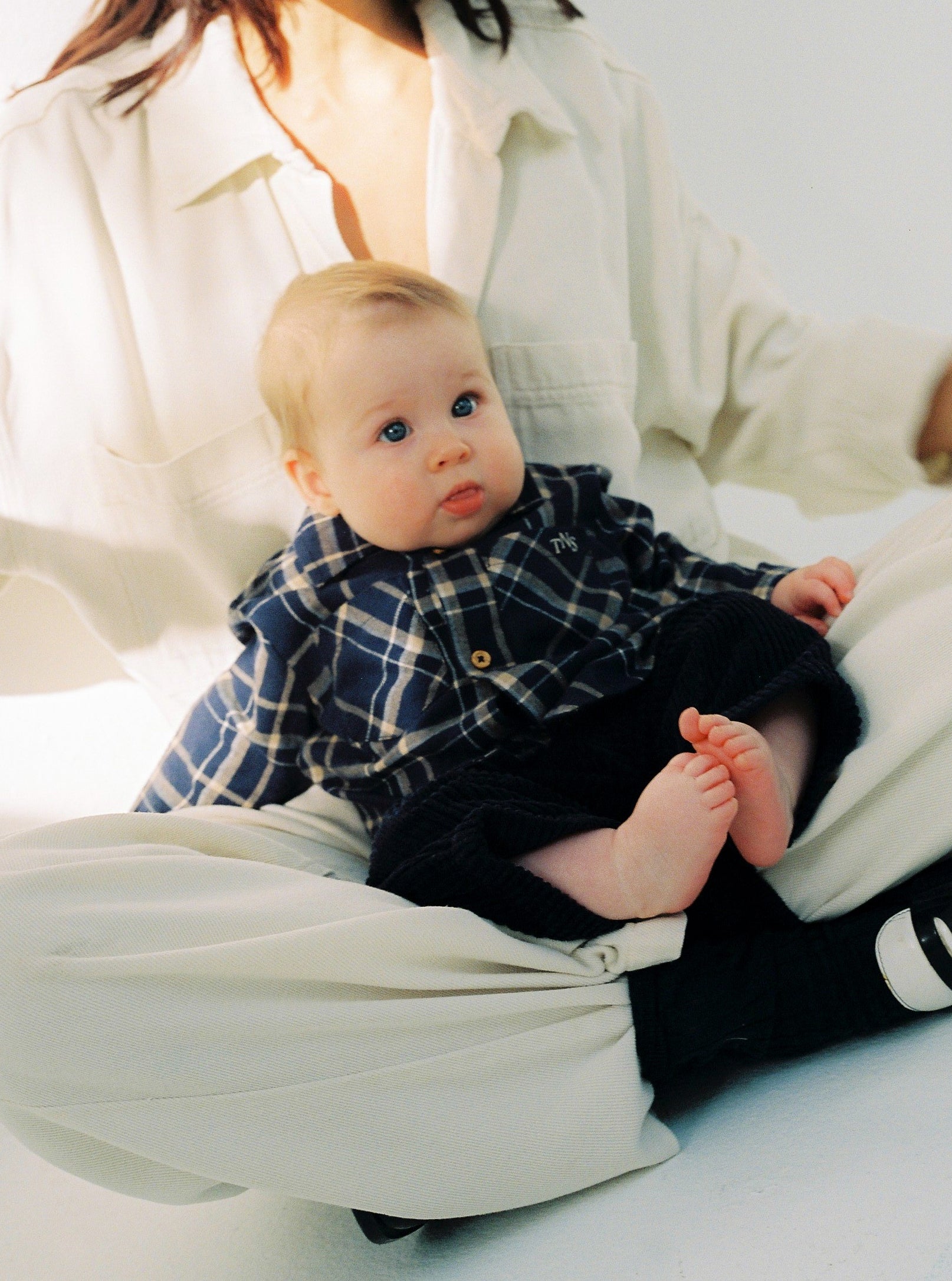 Plaid flannel shirt with wooden buttons and a TNS embroidered logo on the chest. It comes with matching trousers to create a complete look.