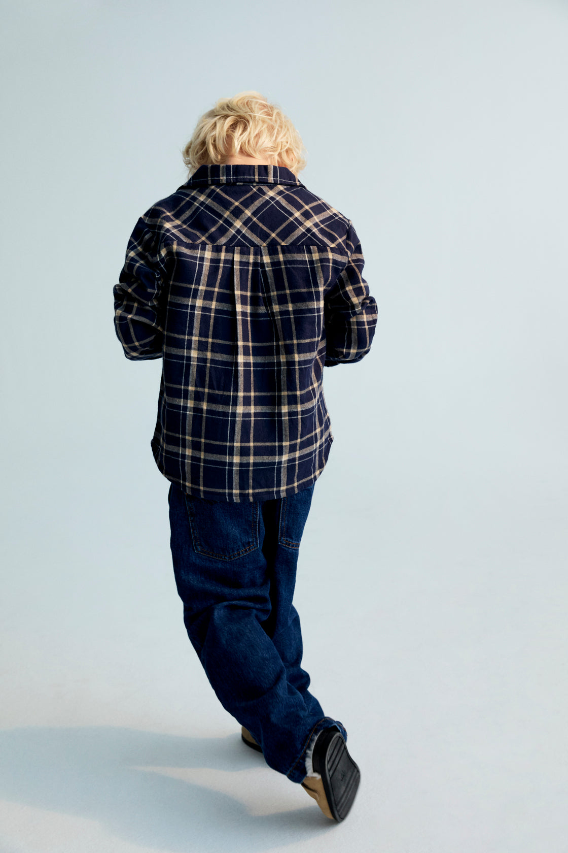 A soft plaid flannel shirt featuring the TNS embroidered logo on the chest. Designed to pair perfectly with the matching trousers for a coordinated, comfortable look.