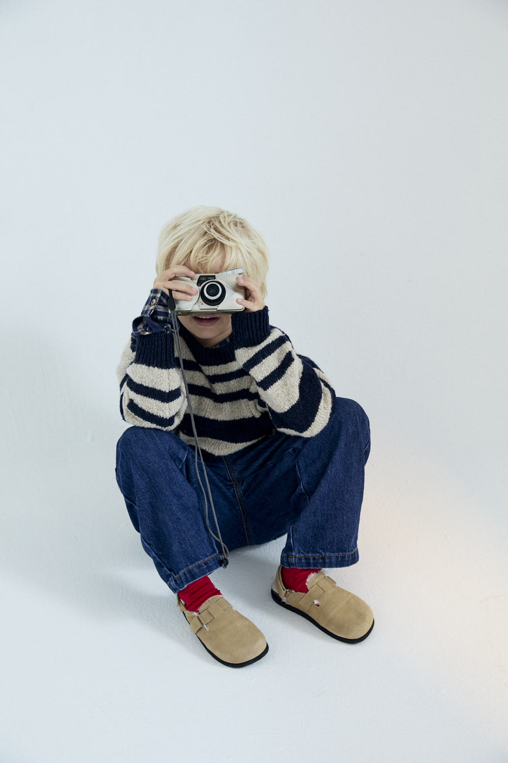 Experience timeless style with our classic striped sweater in a sophisticated two-tone colorway, featuring subtle yet eye-catching contrasting embroidery on the chest.