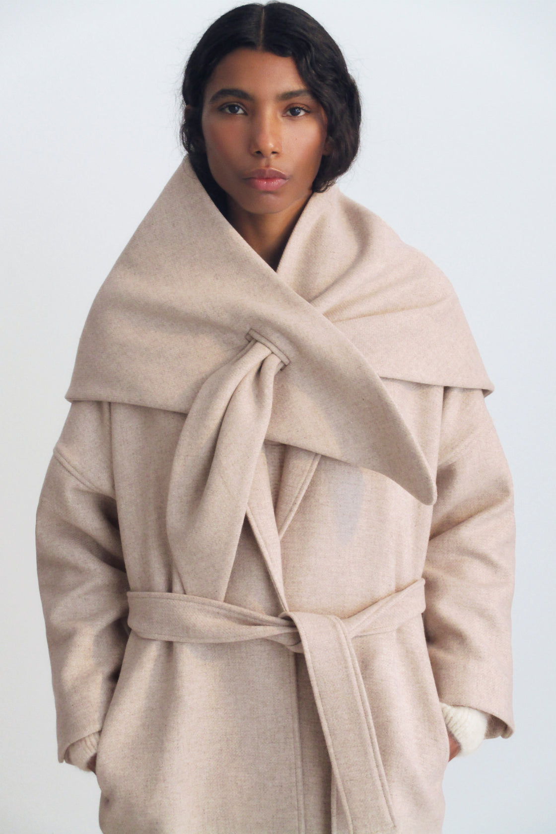Triangular wool scarf with a side slit. Perfect for pairing with the matching wool coat.
