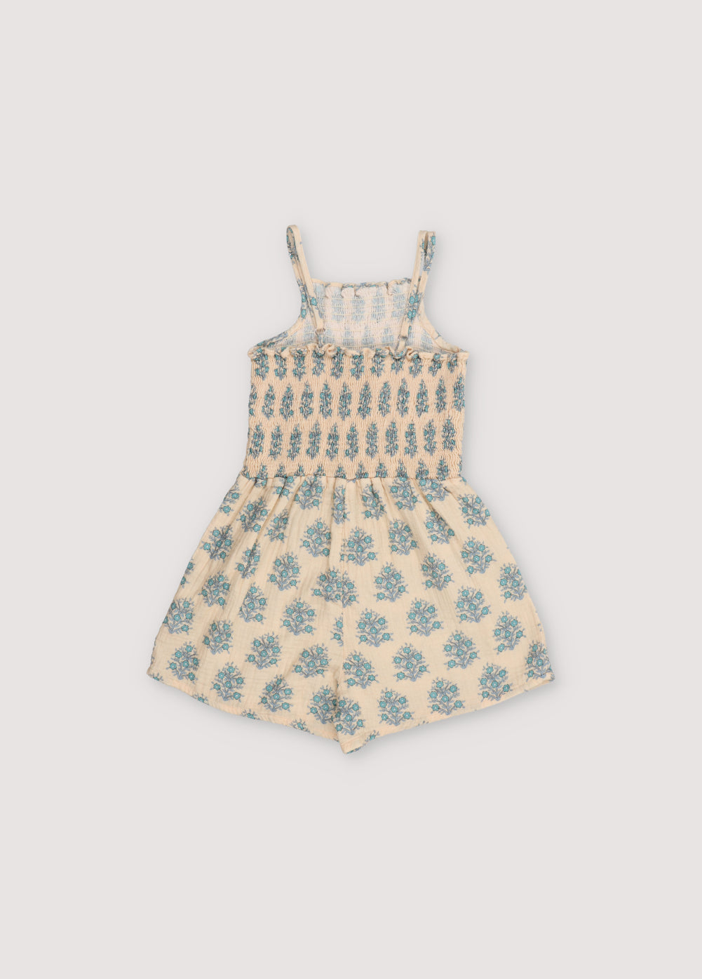 Kyra Jumpsuit in muslin fabric with our Lavender print. Jumpsuit with a smocked top and gathered pants creating the smocking effect for the upper part.