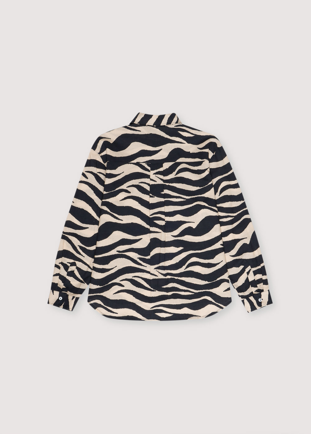 Kavala Woman Shirt in 100% cotton with our zebra print. Long-sleeved shirt with shirt collar and central button closure. Spring Summer Collection. The New Society.