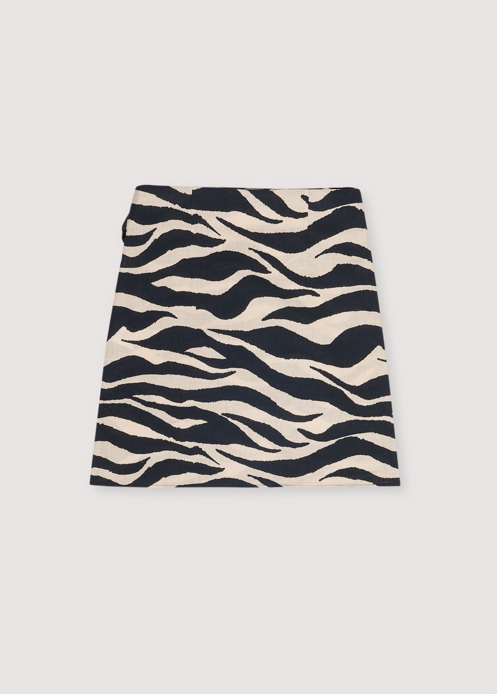 Kavala Woman Skirt in 100% cotton with our zebra print. Short wrap skirt with side knot.