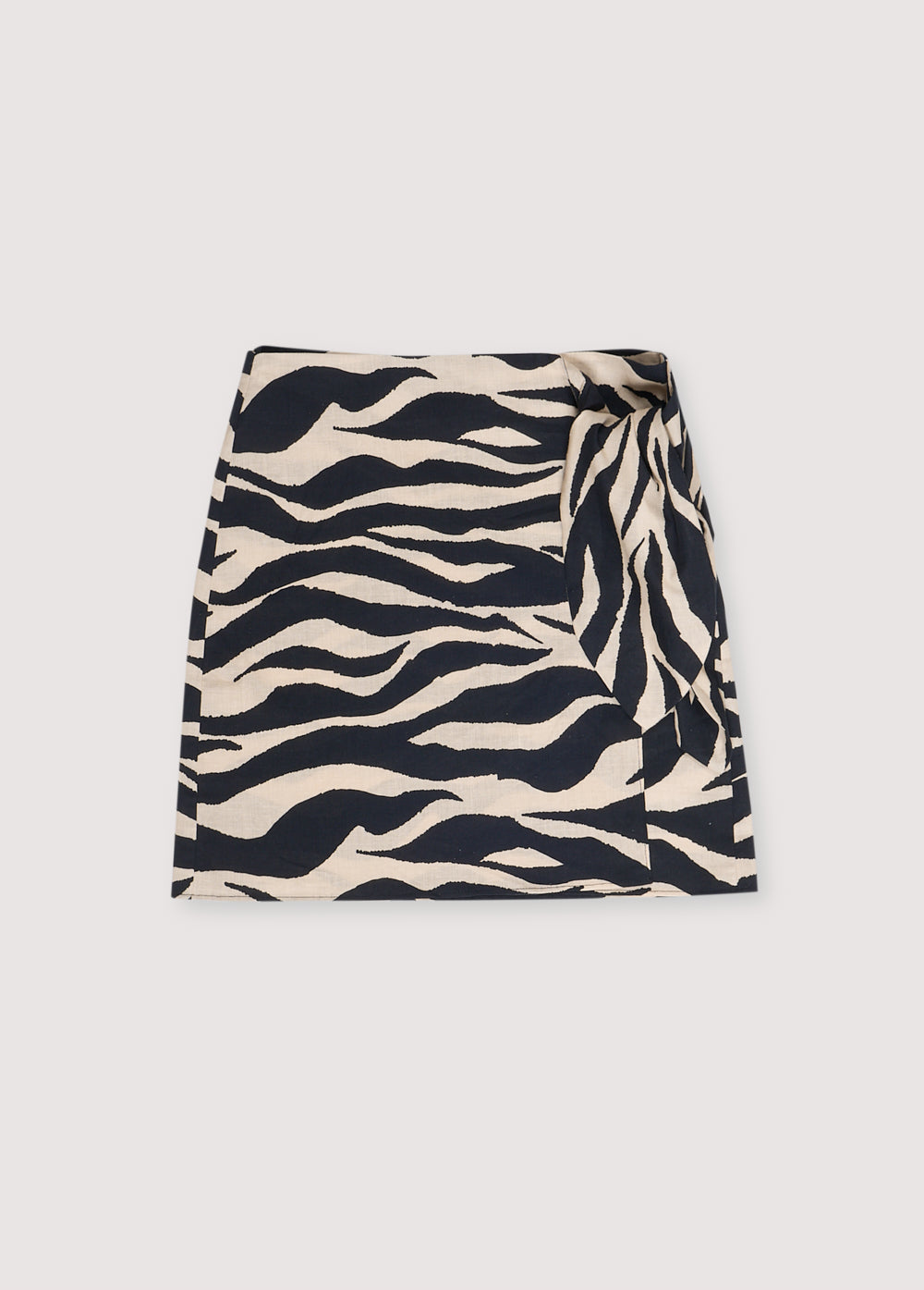 Kavala Woman Skirt in 100% cotton with our zebra print. Short wrap skirt with side knot.