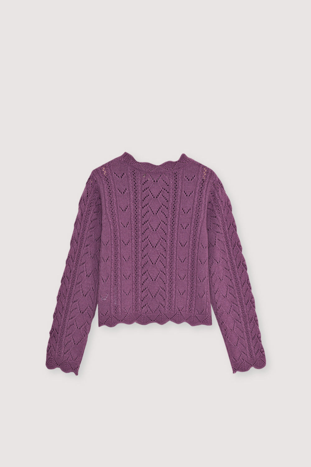 Recycled cashmere and wool knit sweater with beautiful curved finishes on the neckline, cuffs, and hem. It comes with a matching skirt to create a complete look.