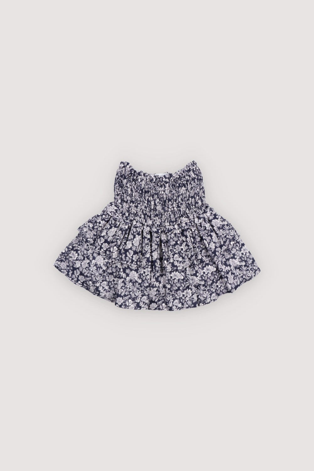 Our timeless classic skirt features smocking at the waist and delicate double ruffles, crafted from soft floral-printed double gauze fabric