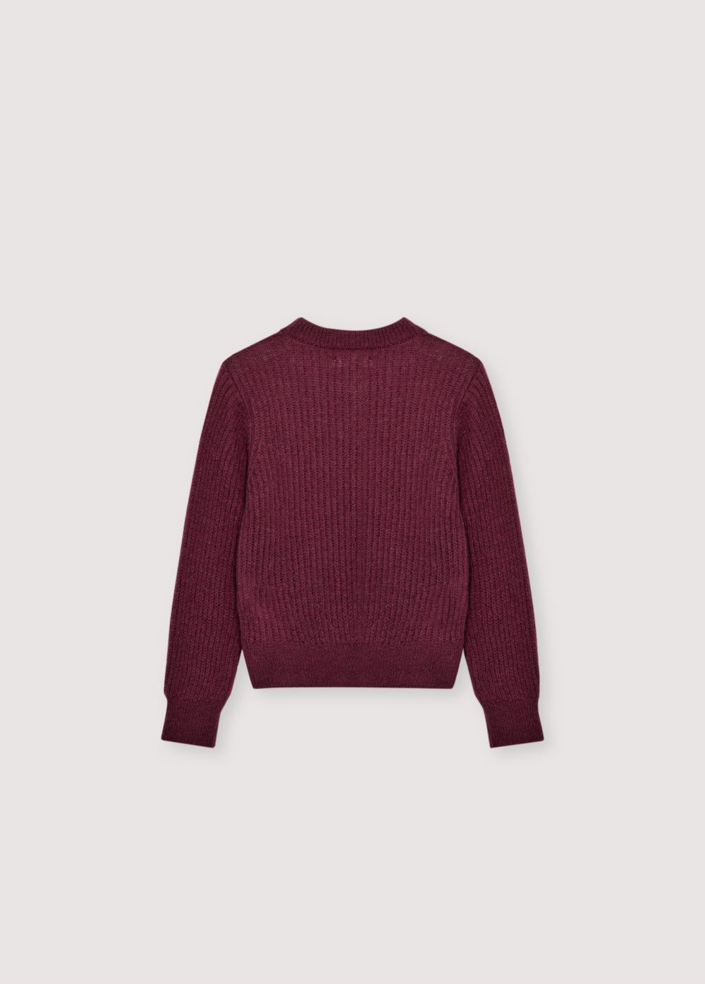 Fine rib knit mohair sweater with a round neckline and ribbing at the neck, cuffs, and hem. It feautures a TNS embroidery on tone on hem rib.