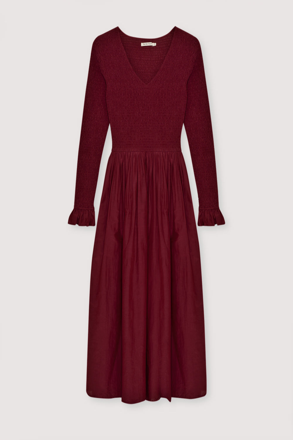 One of our best-selling dress styles, made from high-quality cambric fabric with a smocked bodice and V-neckline. Available in two colors.