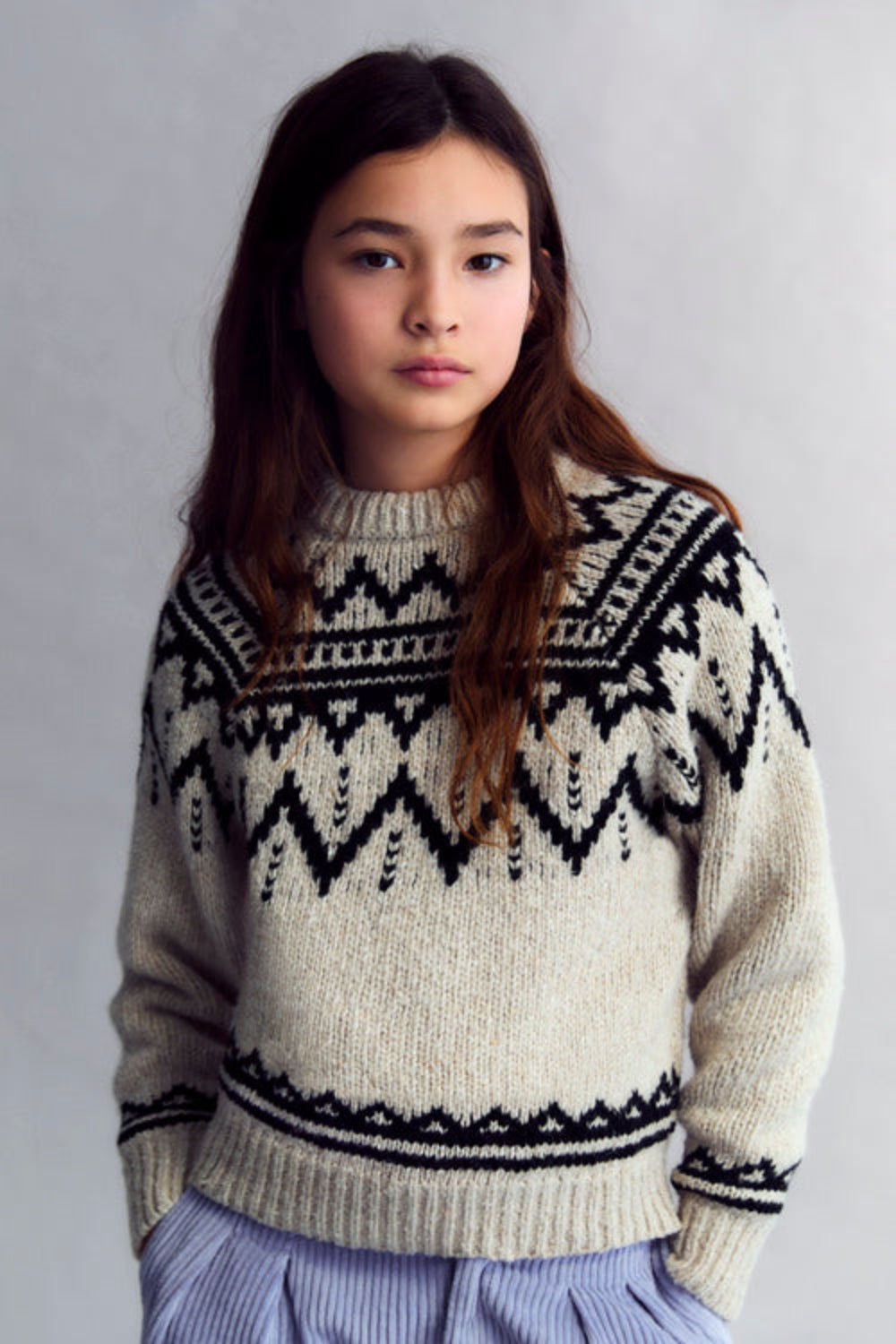 Wool sweater with a beautiful jacquard contrast detail on the front, back, and sleeves.