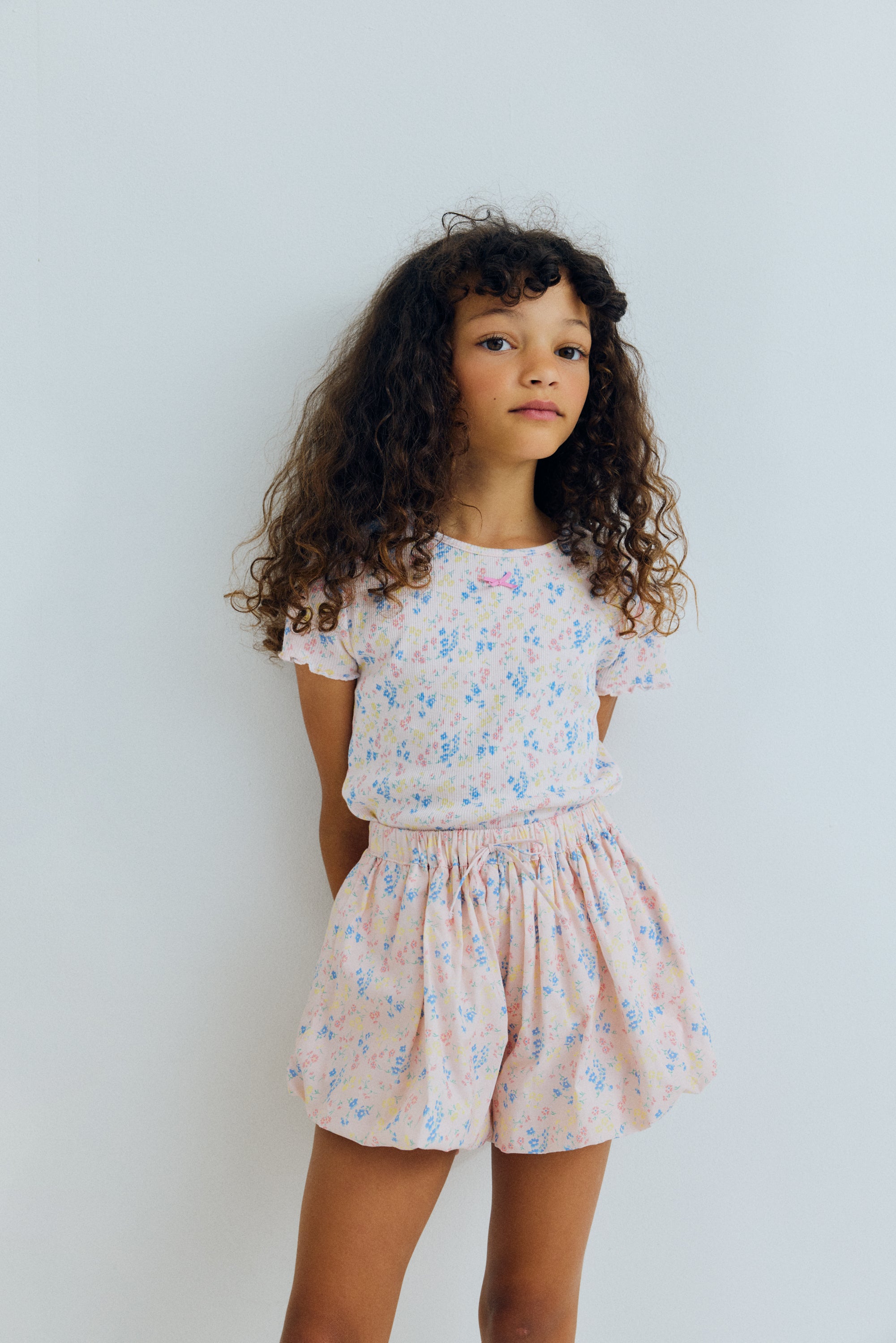 Organic cotton shorts with a beautiful floral print and a balloon style silhouette, creating a playful and distinctive shape.